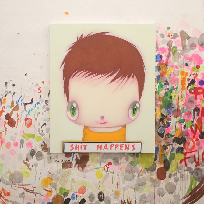Painting of large-eyed cartoon child placed centrally on a white surface surrounded by splashes of paint and scribbles