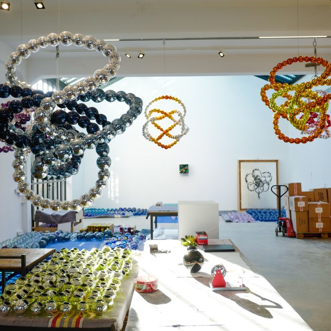 The studio of Jean-Michel Othoniel filled with beads and hanging sculptures