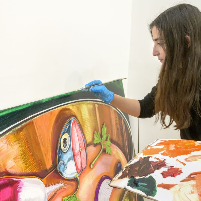 Nikki Maloof painting fish in studio
