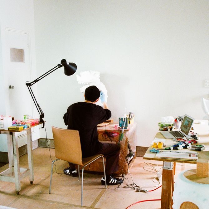 Takahiro Komuro sat working in his studio