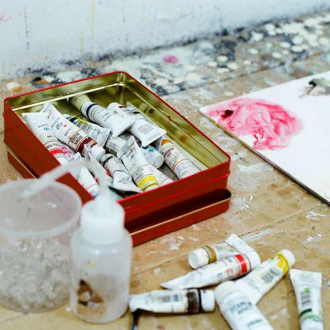 pot of paints in the artist's studio