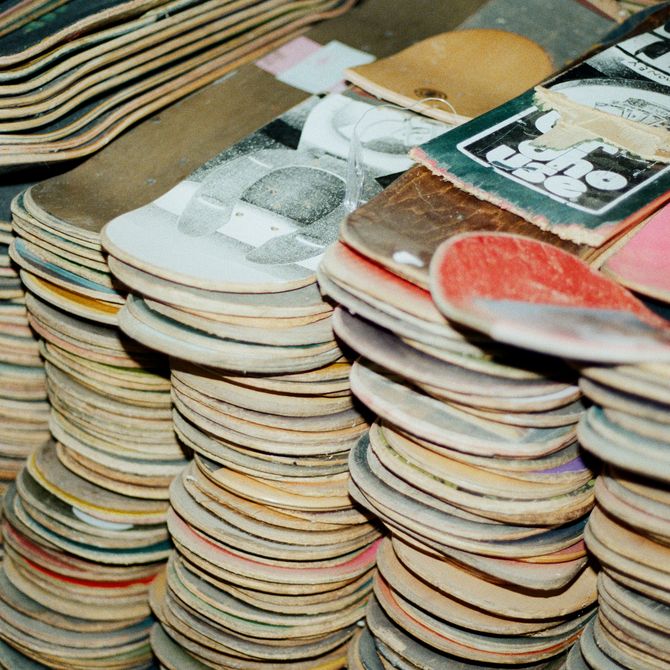 a large pile of skateboards