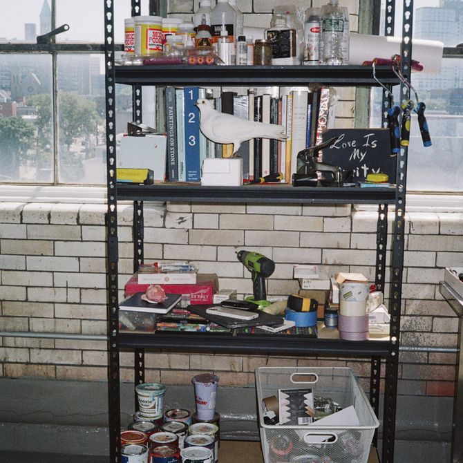 various miscellaneous objects stacked on shelves in Bony Ramirez's studio 