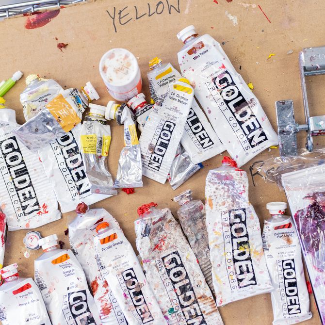 tubes of oil paints on a piece of cardboard