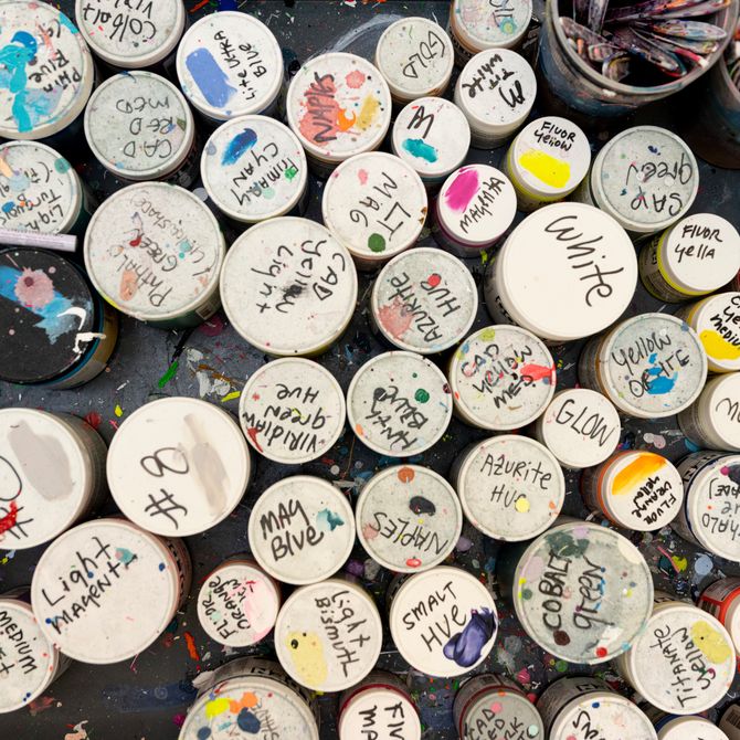 Erik Parker paints spread out in named jars across floor
