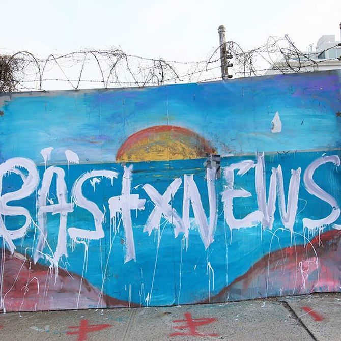 'BAST NEWS' painted in white on a simply-painted seascape