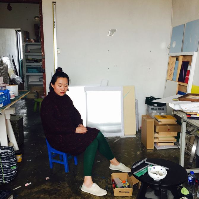 Zhang Ruyi sat in her studio looking at the floor