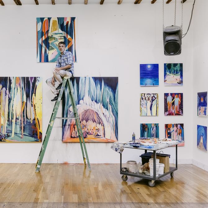 Jules de Balincourt sat at the top of a tall ladder in his studio