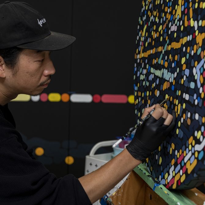 Yoon Hyup painting a large canvas