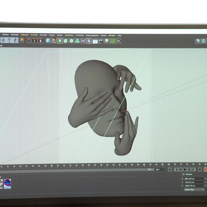 photo of a computer screen showing an in-progress render of a floating head surrounded by 3 hands