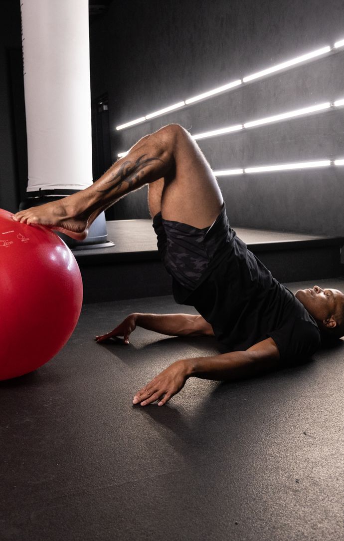 Flo Master Doing a Stability Ball Hamstring Curl