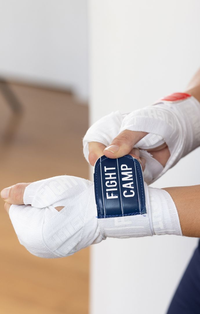 Boxer Securing Traditional Hand Wrap on Wrist