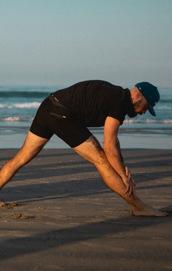 Aaron Swenson Doing Leg Stretches