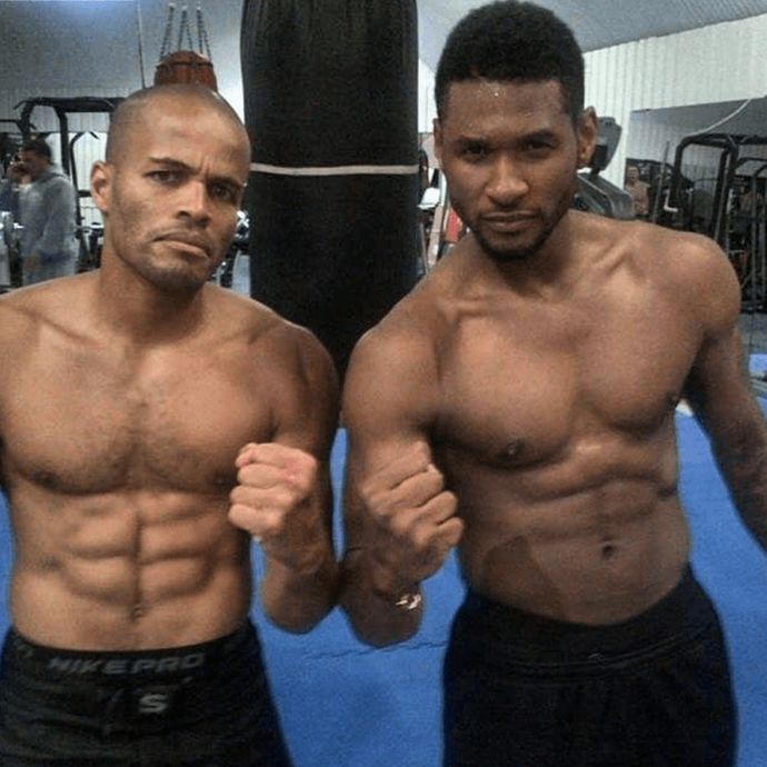 Singer Usher With FightCamp Trainer Flo Master