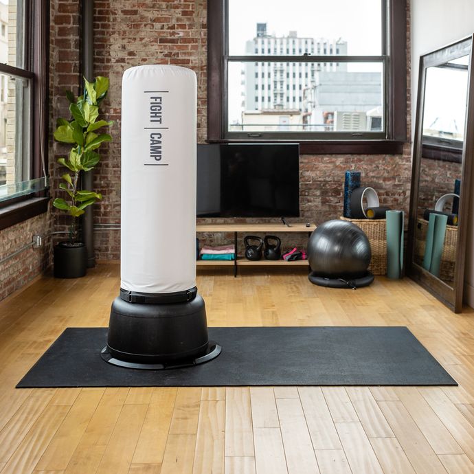 At-Home Workout Space With Exercise Mat and Heavy Bag
