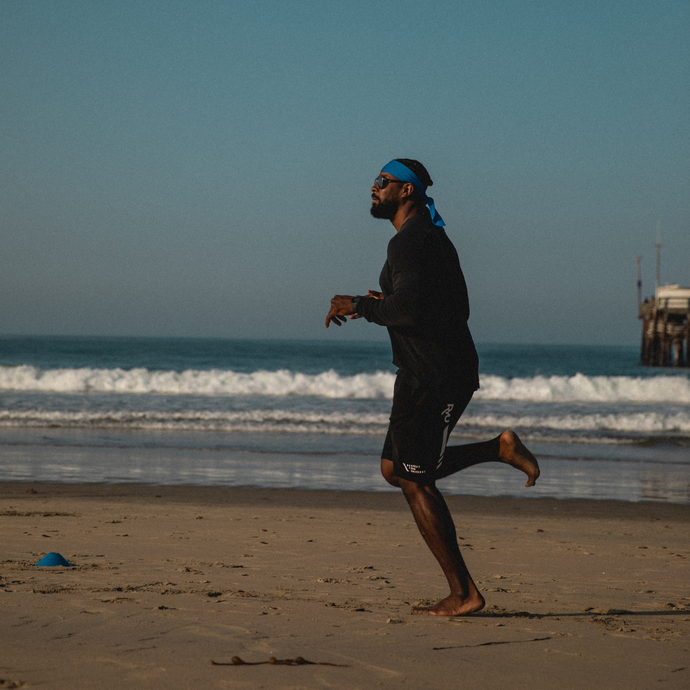 Coach PJ Running at the Beach