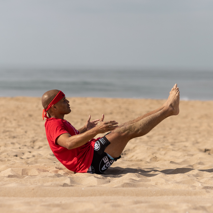 Flo Master doing exercises on the beach