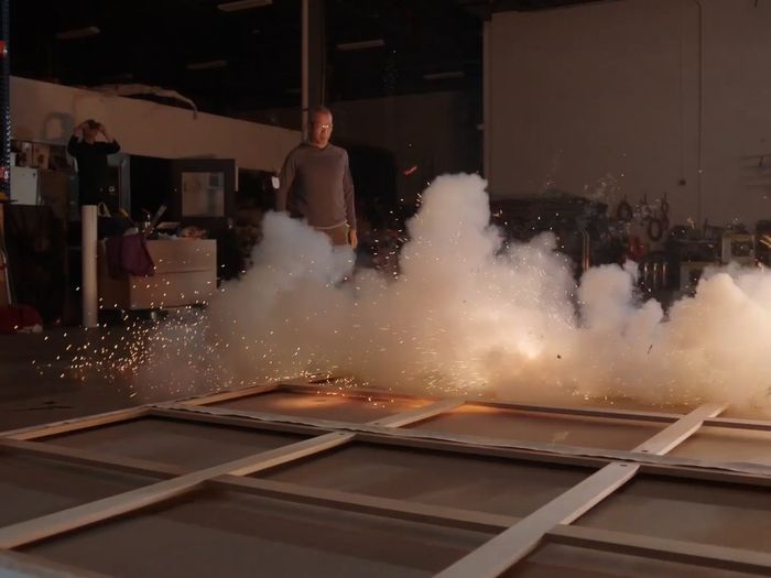 Artist Cai Guo-Qiang igniting one of his installation, studio visit