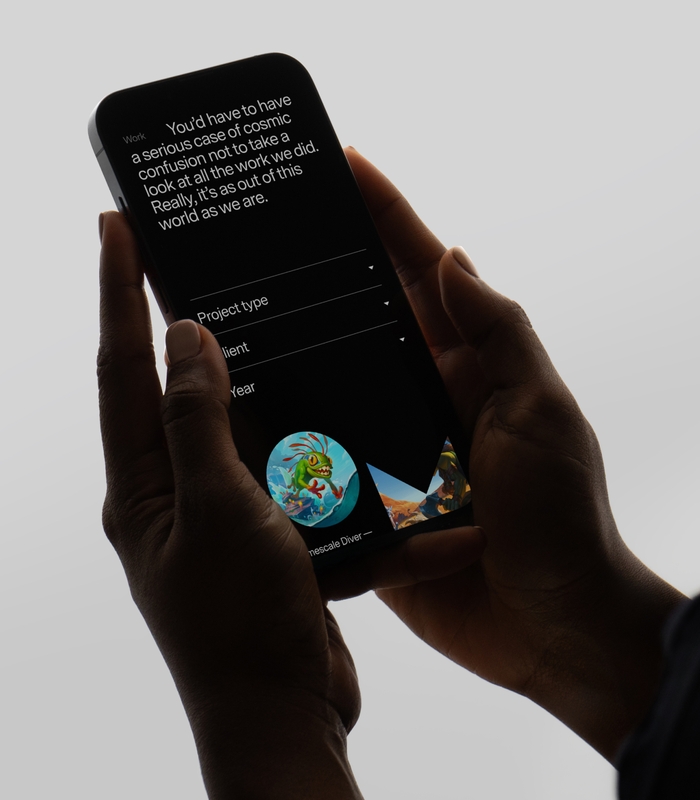 iPhone in hand with the Mooncolony website open