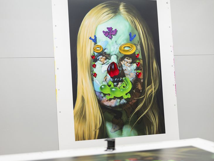 grotesque portrait on a print display stand