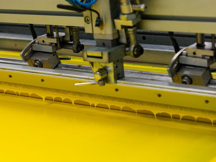 printing screen flooded with canary yellow ink