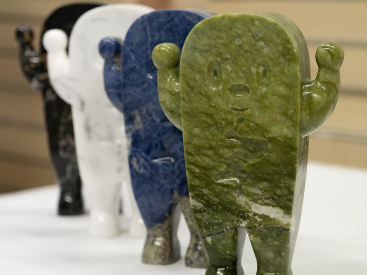 four marble sculptures lined up in different colourways