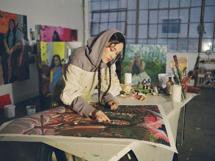 Gisela McDaniel hand finishing her prints in her studio 