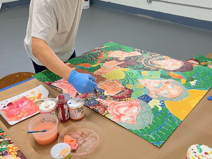 Koichi Sato hand-finishing prints in his studio