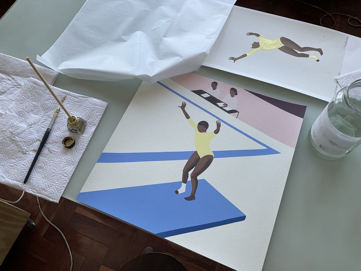 Painting of a gymnast on a table alongside a pot of gold paint