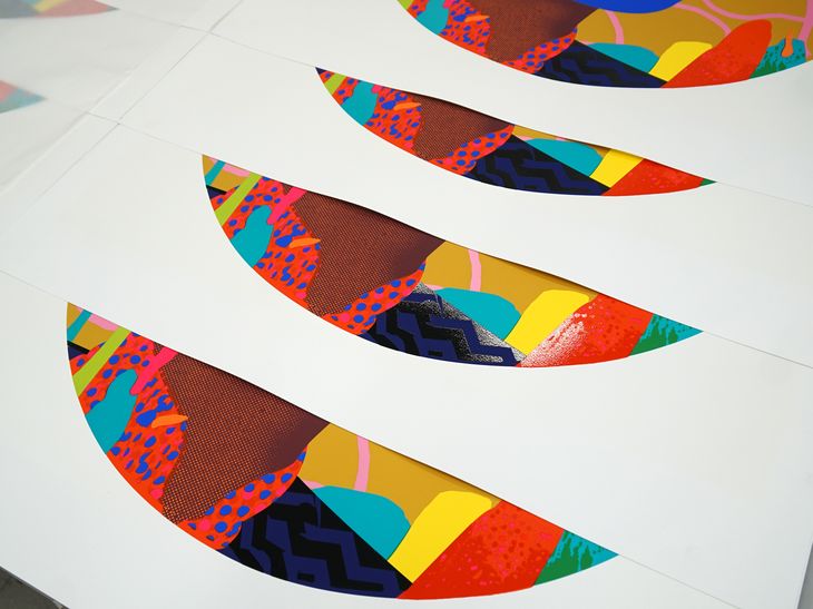 in production shot of a circular prints by Paul Insect stacked on top of each other