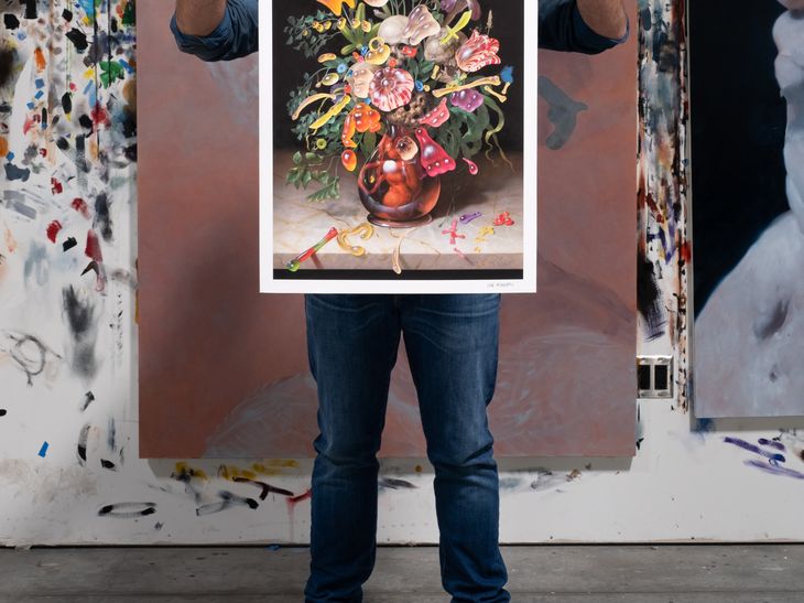 Van Minnen holding print infront of him with two hands