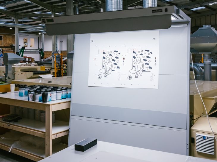 behind-the-scenes of fishbowl prints being produced in a large printing warehouse
