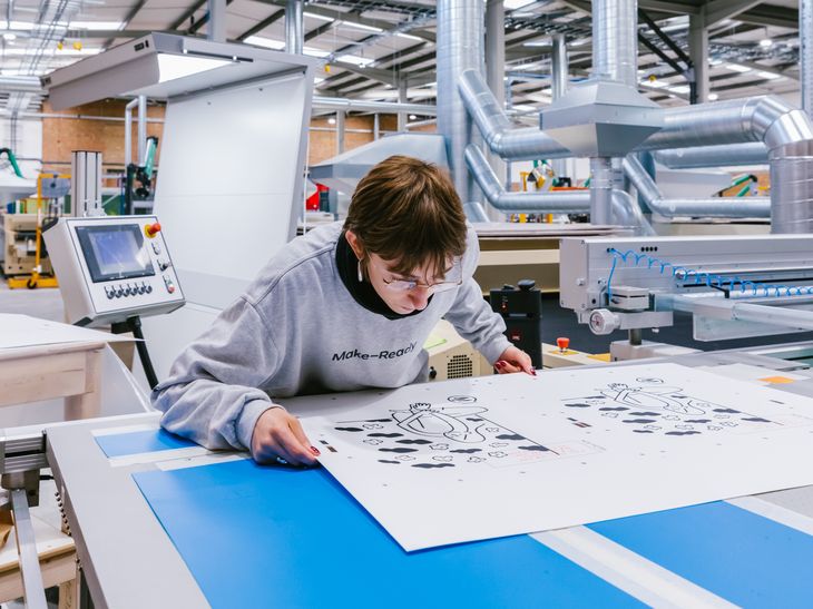 behind-the-scenes of fishbowl prints being produced in a large printing warehouse