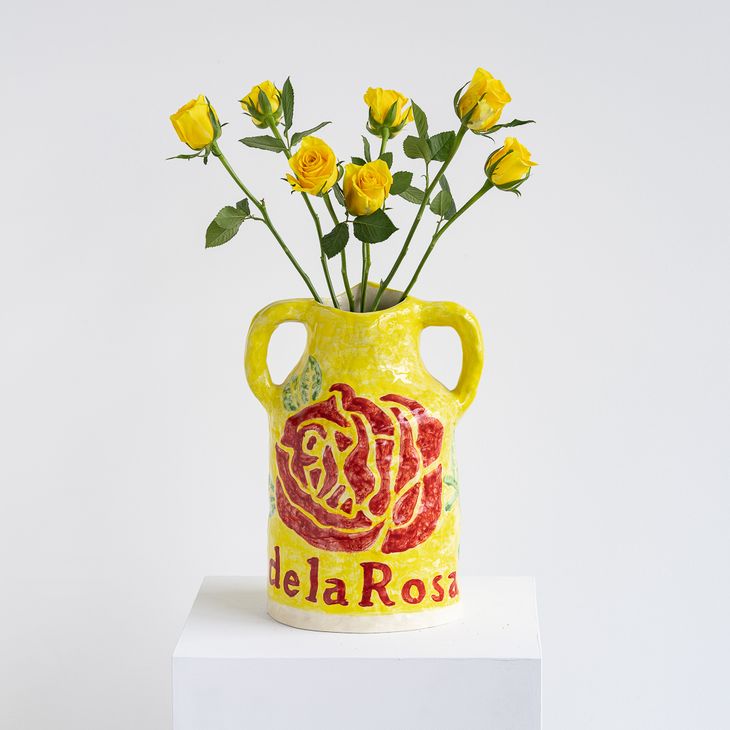 Grant Levy vase filled with yellow roses