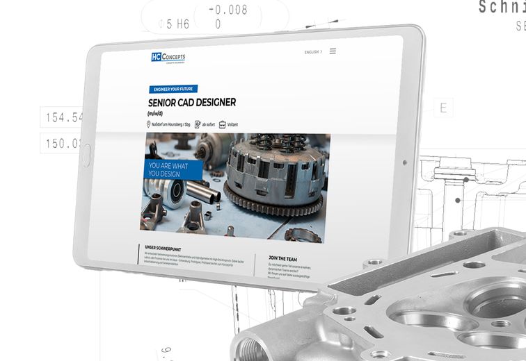Tablet mit HC-Concepts Webseite und Motor um Vordergrung