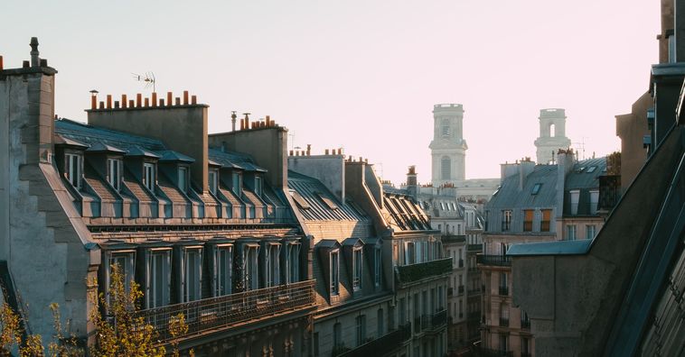 rooftops of buildings in paris france in the morning