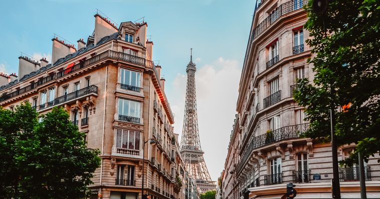 buildings on a street opening to the eiffel tower in paris france