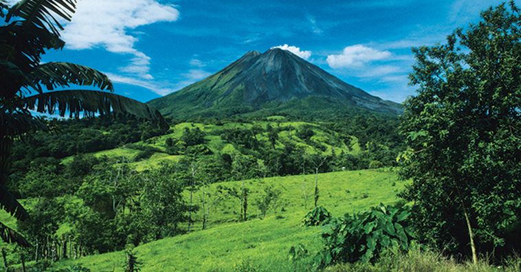 arenal volcano surrounded by jungle in costa rica