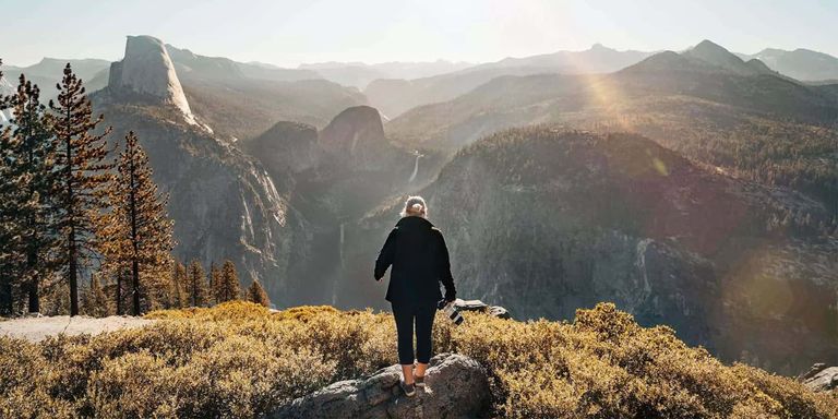 A girl gazing out over Yosemite National Park.