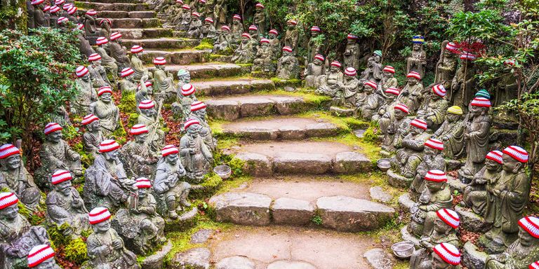 The staircase, lined with hundreds of Buddhist statues, leading up to Daisho-in Temple on Miyajima Island, Japan