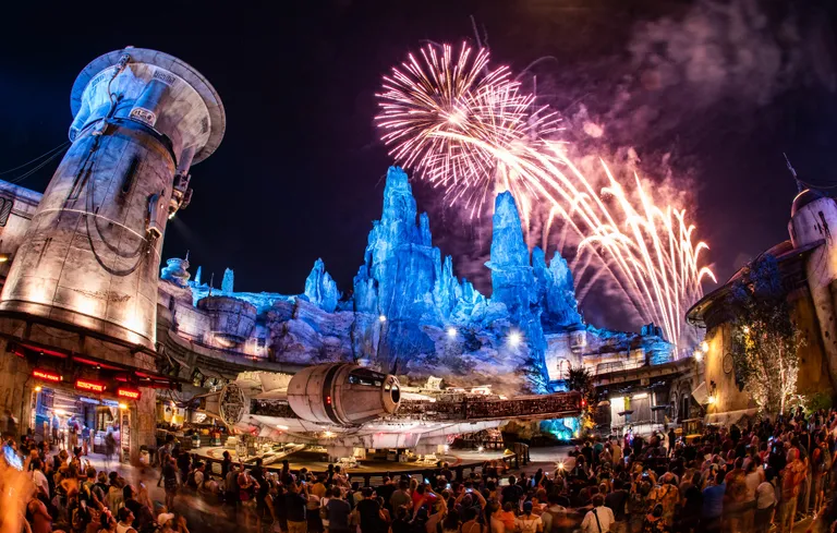 A night sky is lit up by fireworks at Disneyland's Galaxy Edge