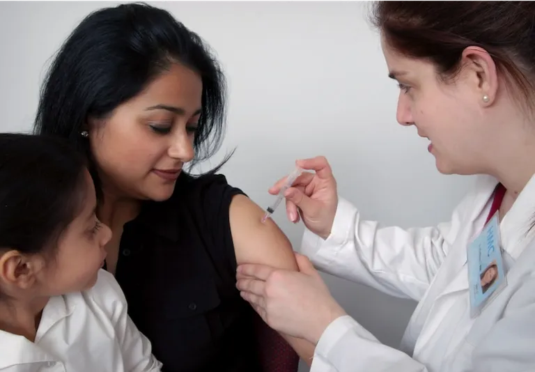 A woman receiving a vaccine