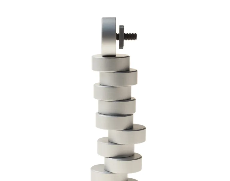 Multiple round puck screws are stacked on top of each other against a white background.