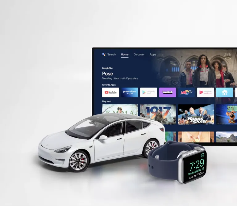 An EV car, smartwatch, and TV are displayed
