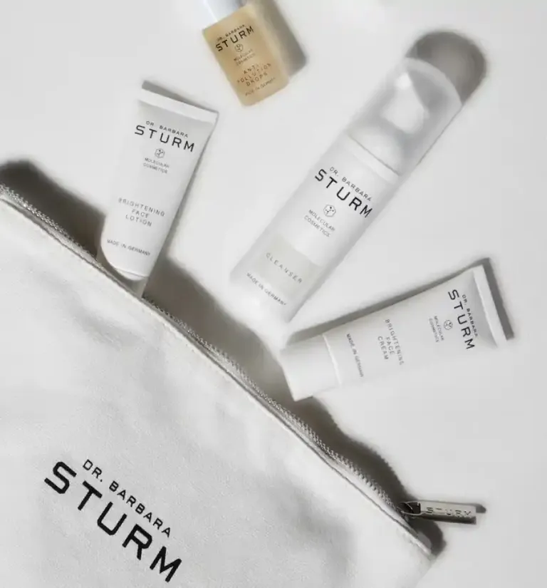 A range of Dr. Barabara Sturm products coming out of a bag