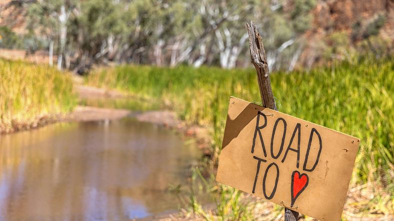Sign saying road to love leading to loves Creek