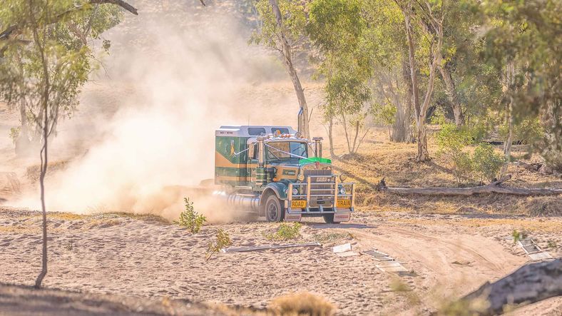 Truck driving on a dirt road in loves creek