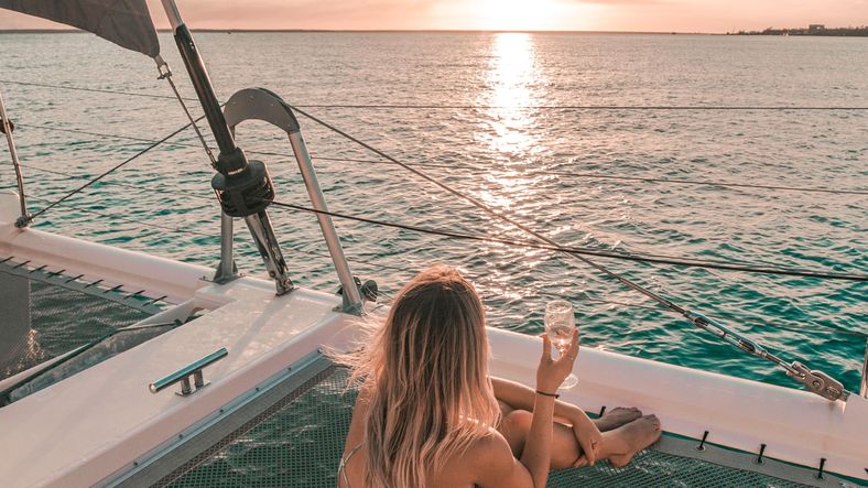 girl watching sunset on boat