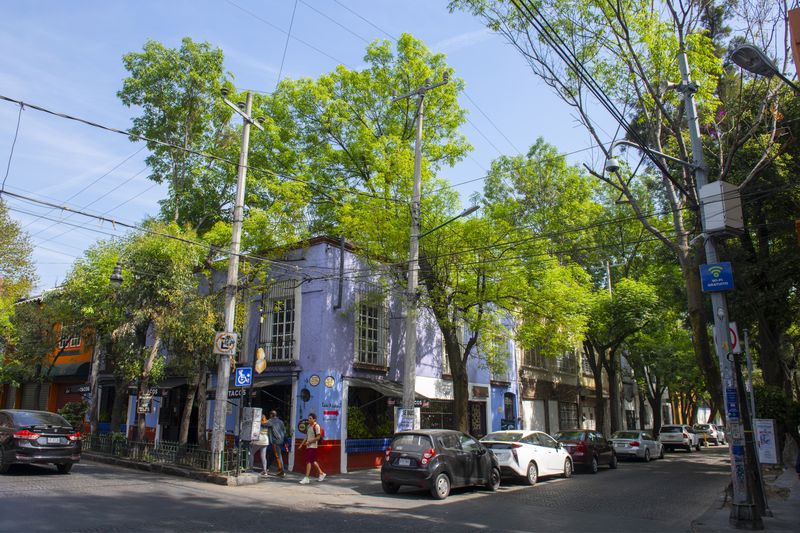 Historic buildings on Felipe Carrillo Puerto Street at Francisco Ortega Street in historic center of Coyoacan, Mexico City