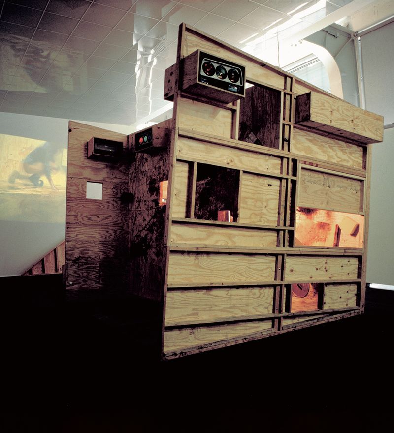 ramshackle plywood set constructed in a gallery space